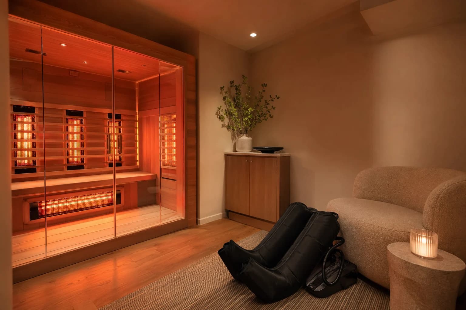 A wellness space with infrared sauna and compression equipment.