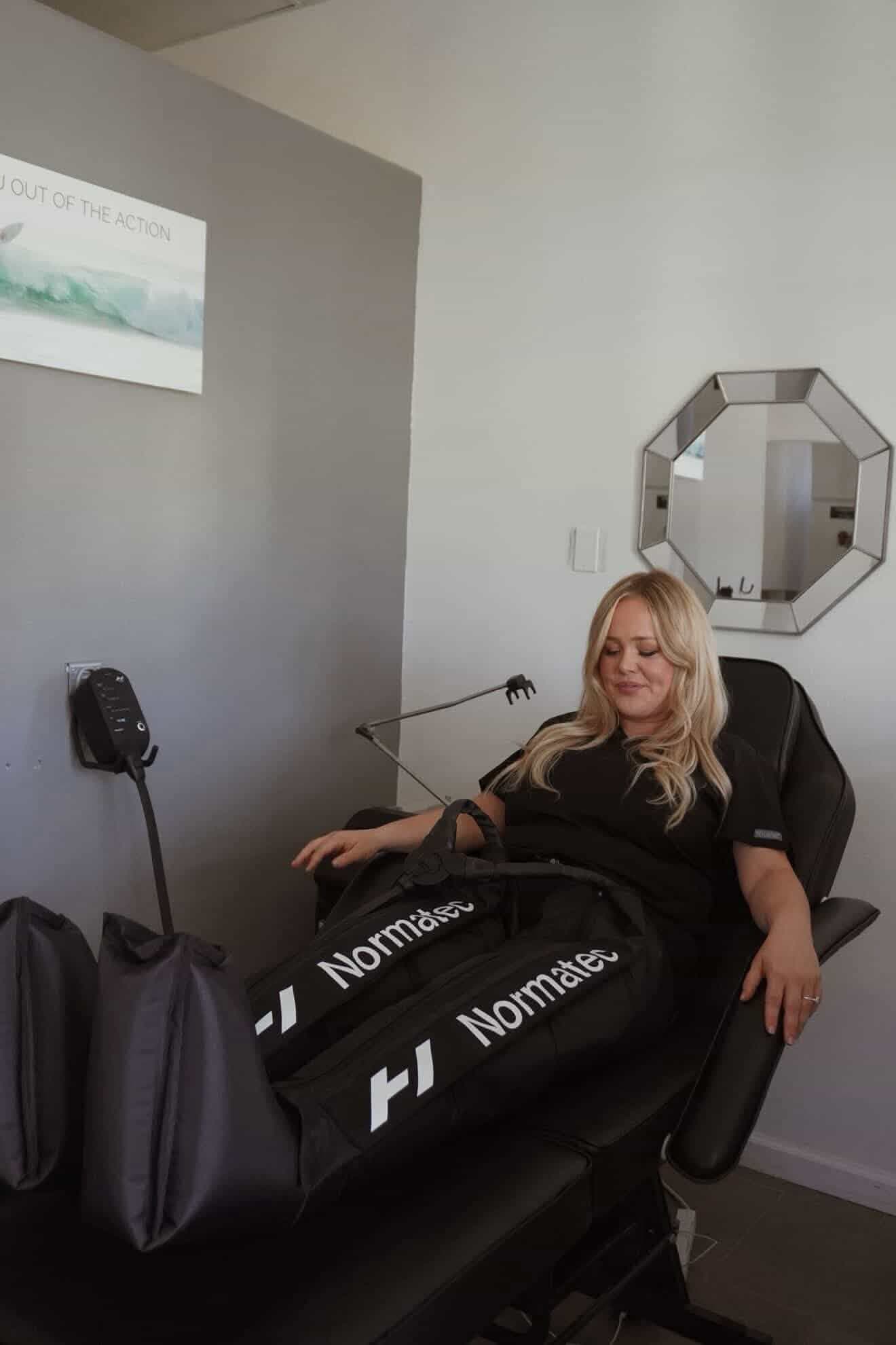 Compression boots on a lounge chair with a blanket inside SK Longevity.